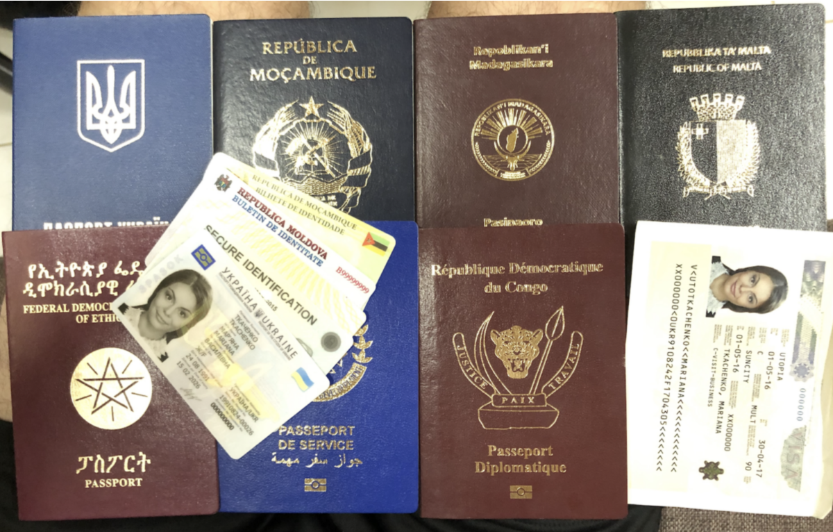 What are some of the blank passport forms printed by Vasily Gritsak's factory and who exactly does he help obtain passports for?